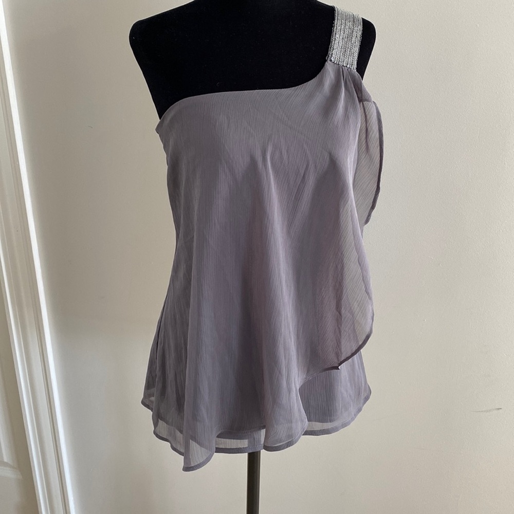 One shoulder top with sparkles on shoulder and sheer material